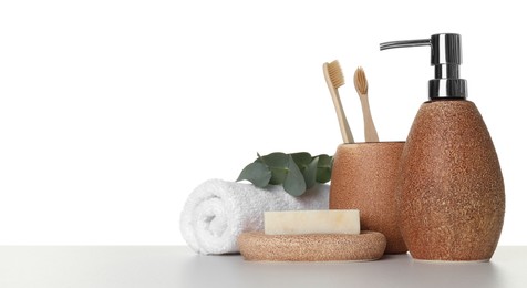 Bath accessories. Different personal care products and eucalyptus branch on table against white background. Space for text