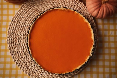 Delicious homemade pie and pumpkin on table, flat lay