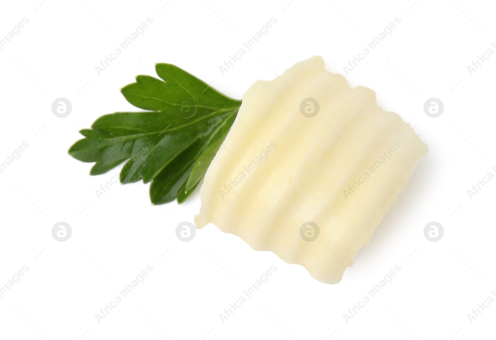 Photo of Tasty butter curl and fresh parsley isolated on white, top view