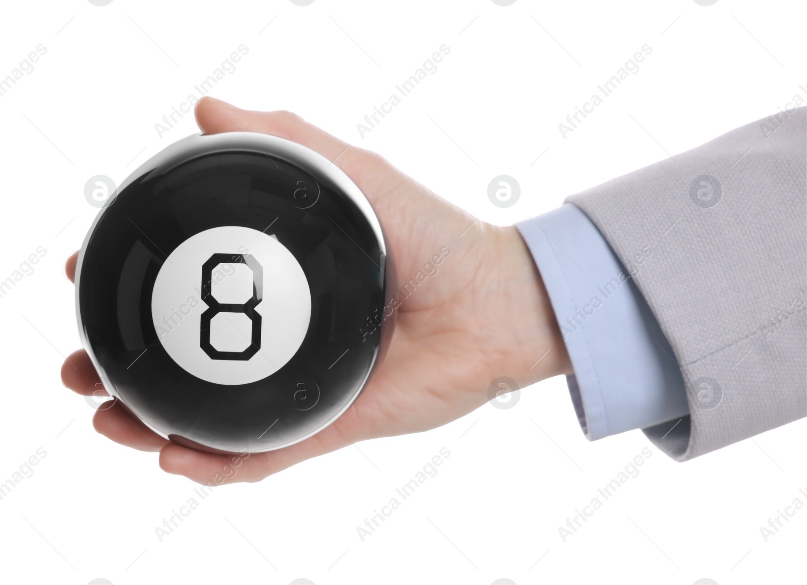 Photo of Man holding magic eight ball on white background, closeup