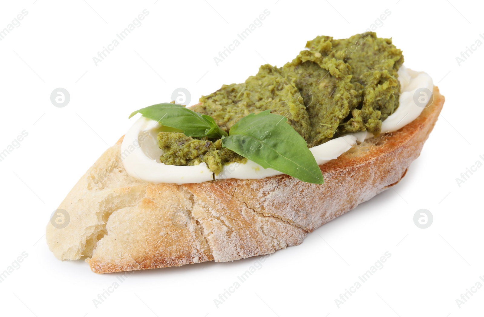 Photo of Tasty bruschetta with cream cheese, pesto sauce and fresh basil isolated on white