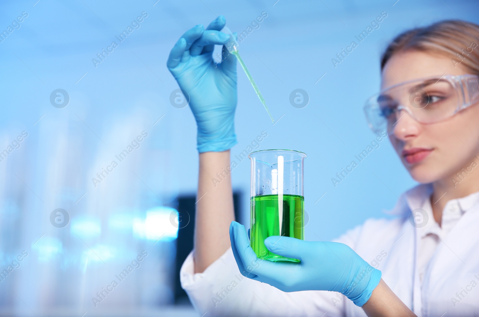 Photo of Female scientist working in chemistry laboratory, space for text