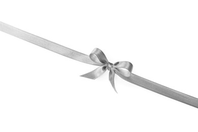 Photo of Silver satin ribbon with bow on white background, top view