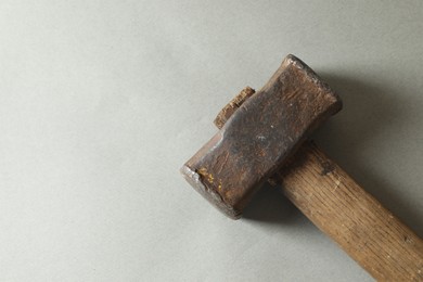 One sledgehammer on grey background, top view. Space for text