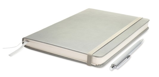 Photo of Closed grey notebook with pen isolated on white