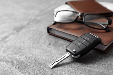 Photo of Composition with male accessories and car key on grey background. Space for text