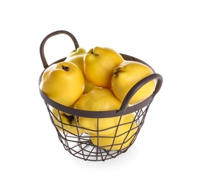 Photo of Fresh ripe quinces in basket on white background