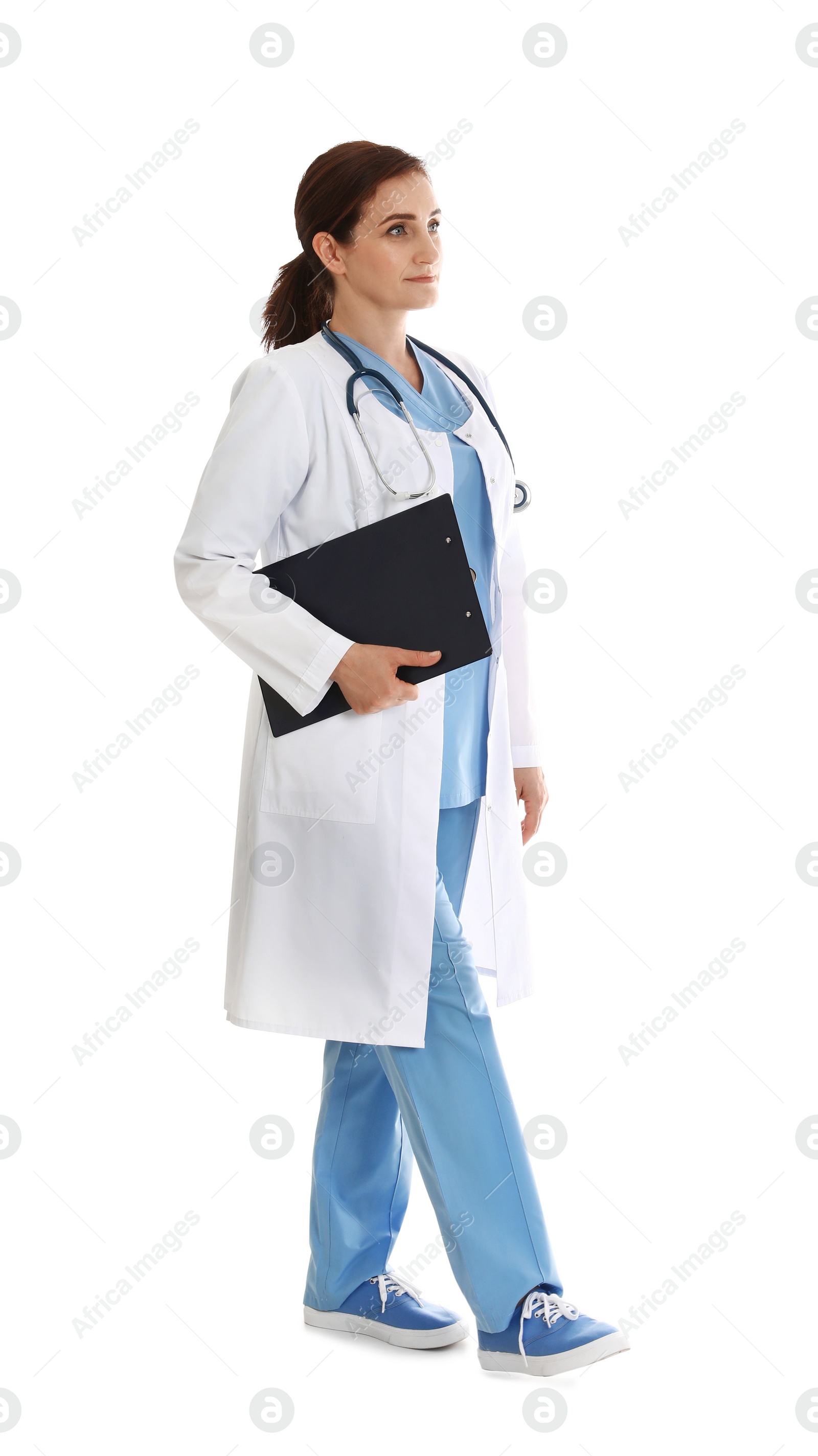 Photo of Full length portrait of female doctor with clipboard isolated on white. Medical staff
