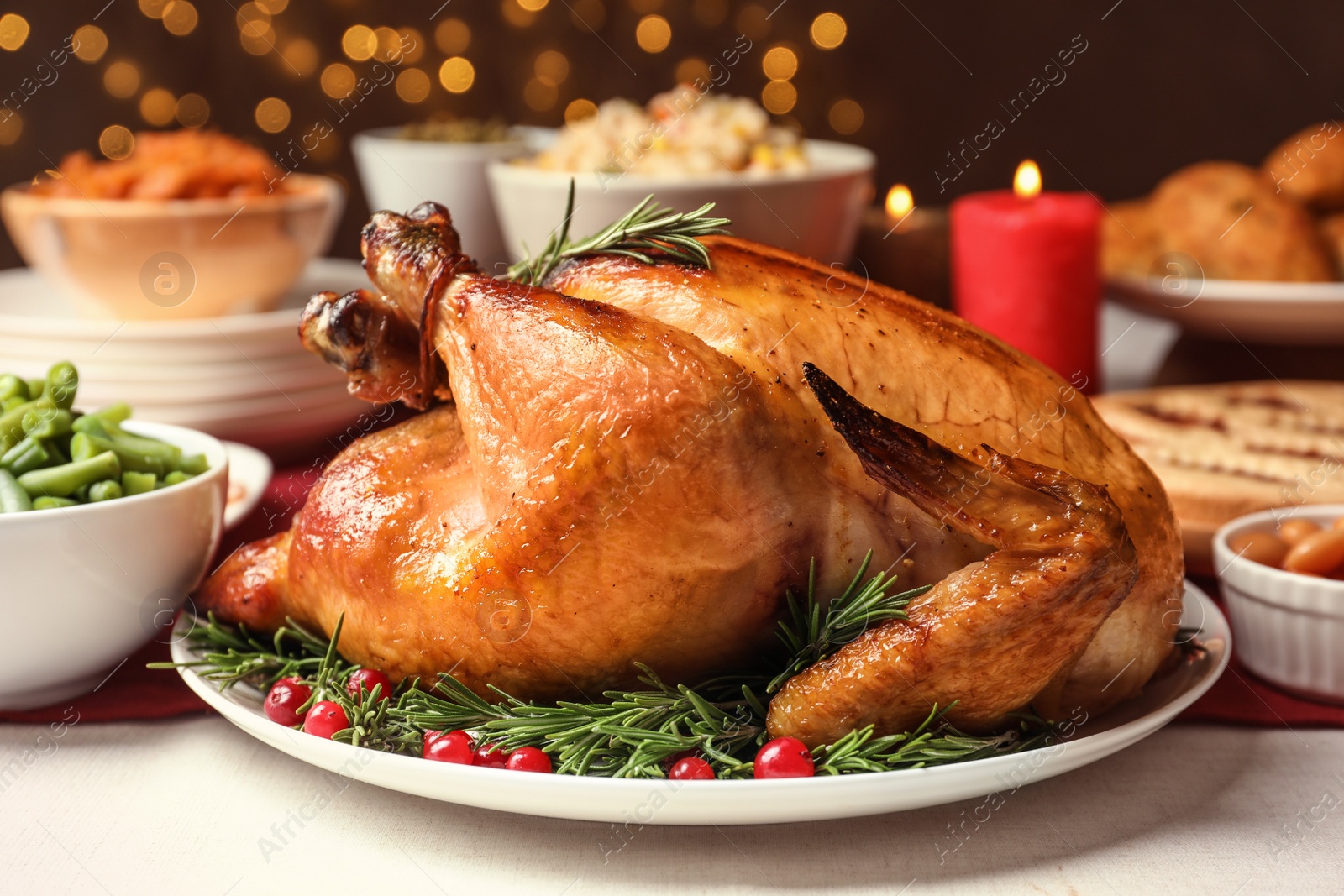 Photo of Traditional festive dinner with delicious roasted turkey served on table