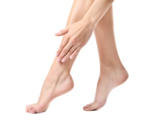 Woman with smooth feet on white background, closeup. Spa treatment