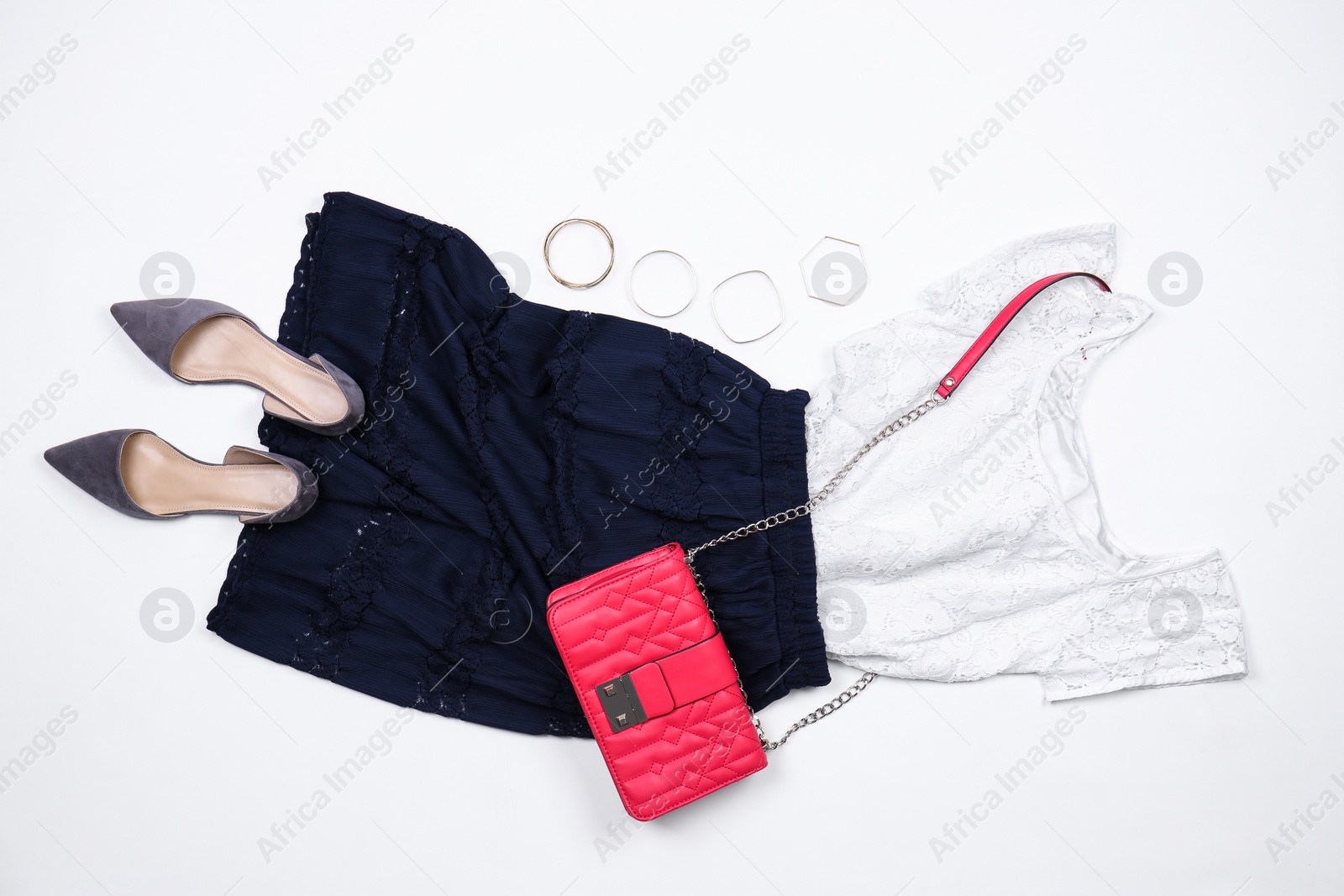 Photo of Set of stylish clothes and accessories on white background, flat lay