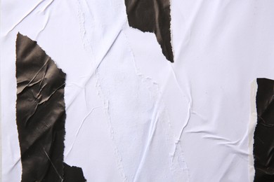 Photo of Texture of white and black ripped paper posters, closeup