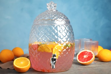 Beverage dispenser with delicious refreshing drink on table