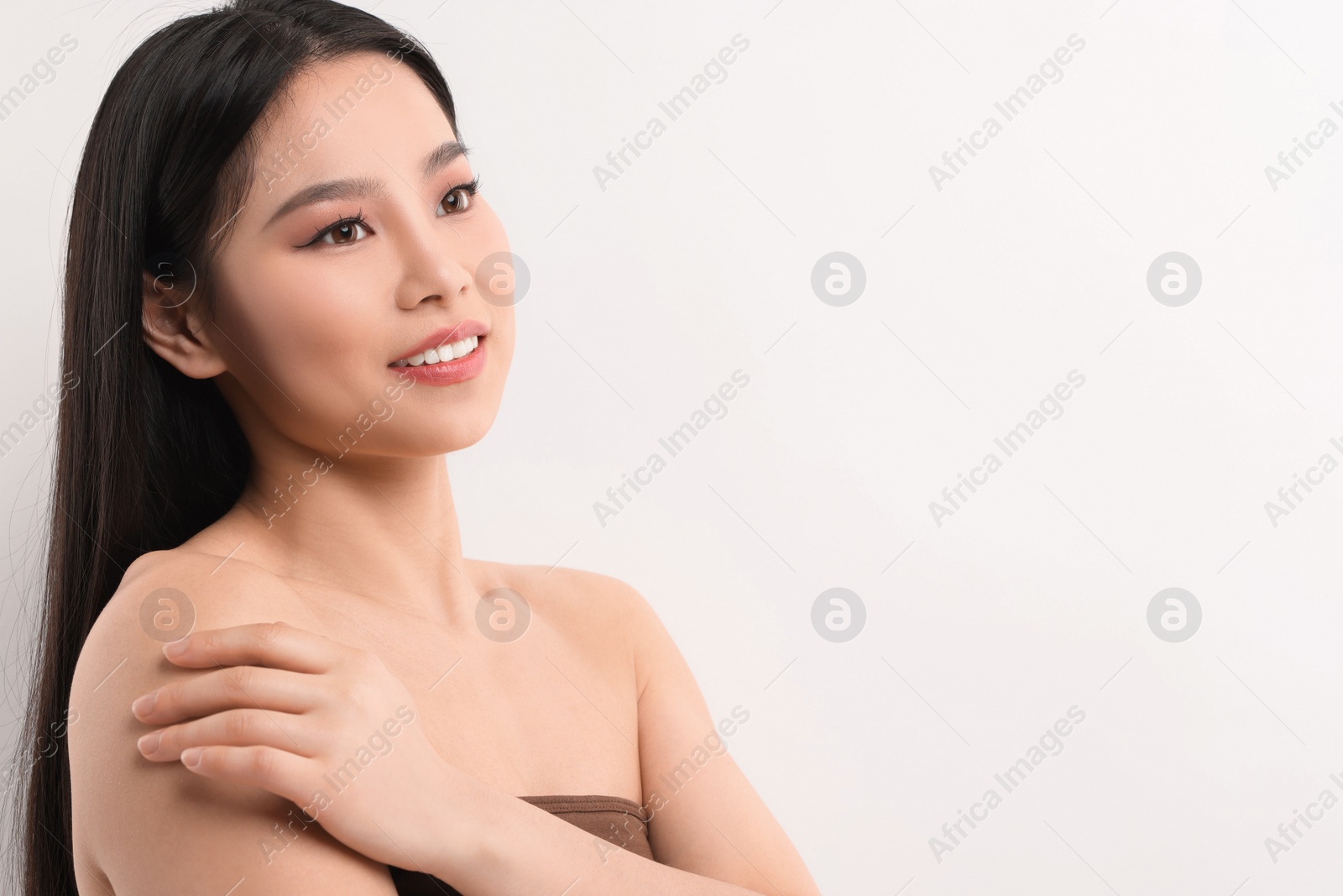 Photo of Portrait of beautiful woman on white background