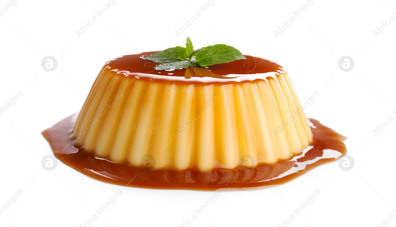 Photo of Delicious pudding with caramel and mint isolated on white