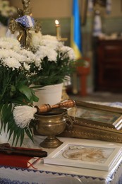 Photo of Stryi, Ukraine - September 11, 2022: Altar with goblet, flowers and icon in Assumption of Blessed Virgin Mary cathedral