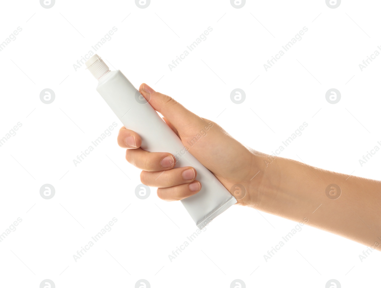 Photo of Woman holding toothpaste against white background. Dental care