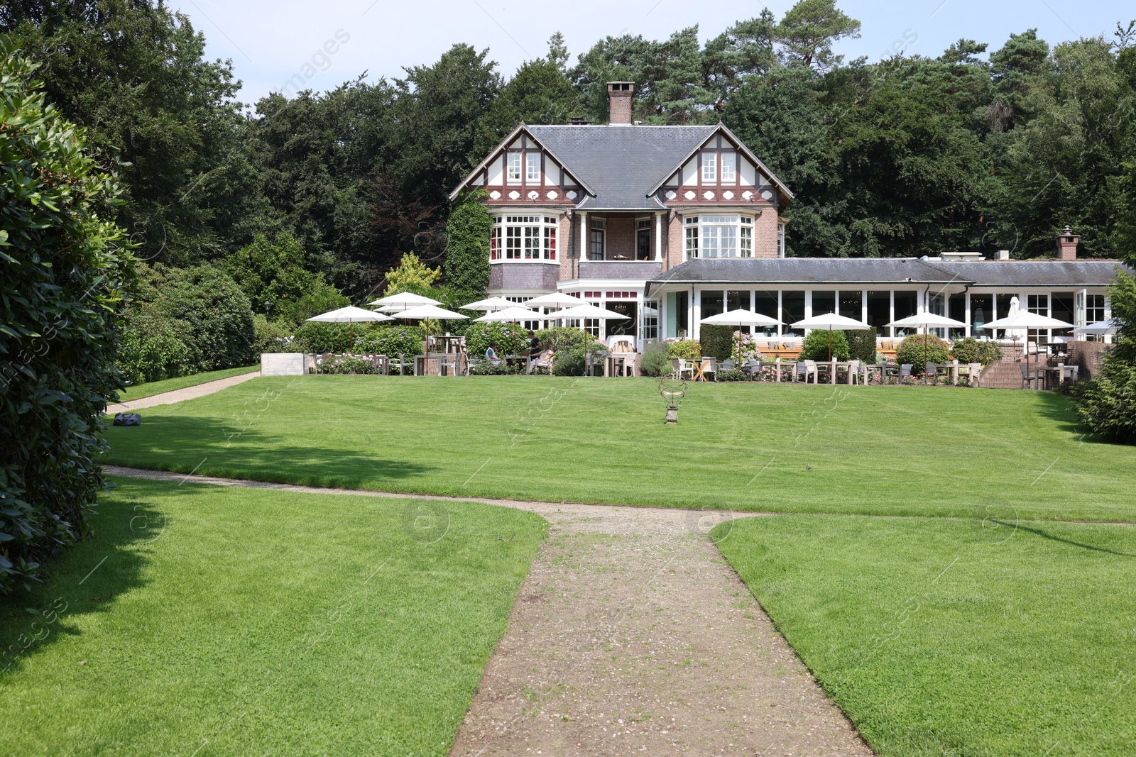 Photo of Ermelo, Netherlands - July 20, 2022: Luxury hotel Het Roode Koper and beautiful plants