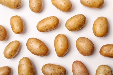 Photo of Flat lay composition with fresh organic potatoes on white background