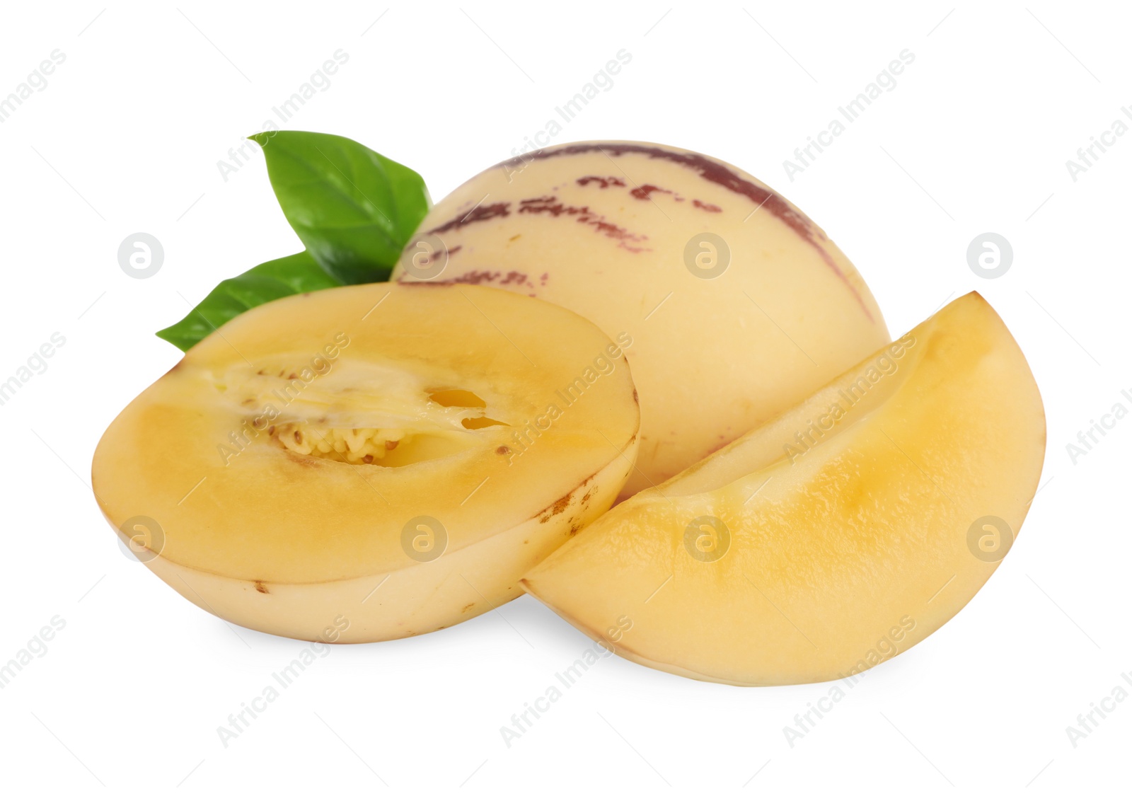 Photo of Whole and cut pepino melons with green leaves isolated on white