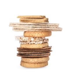 Stack of fresh rye crispbreads, crunchy rice cakes and rusks on white background