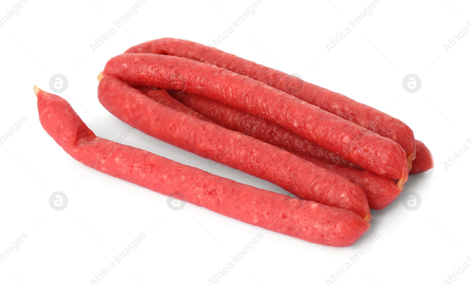 Photo of Thin dry smoked sausages isolated on white