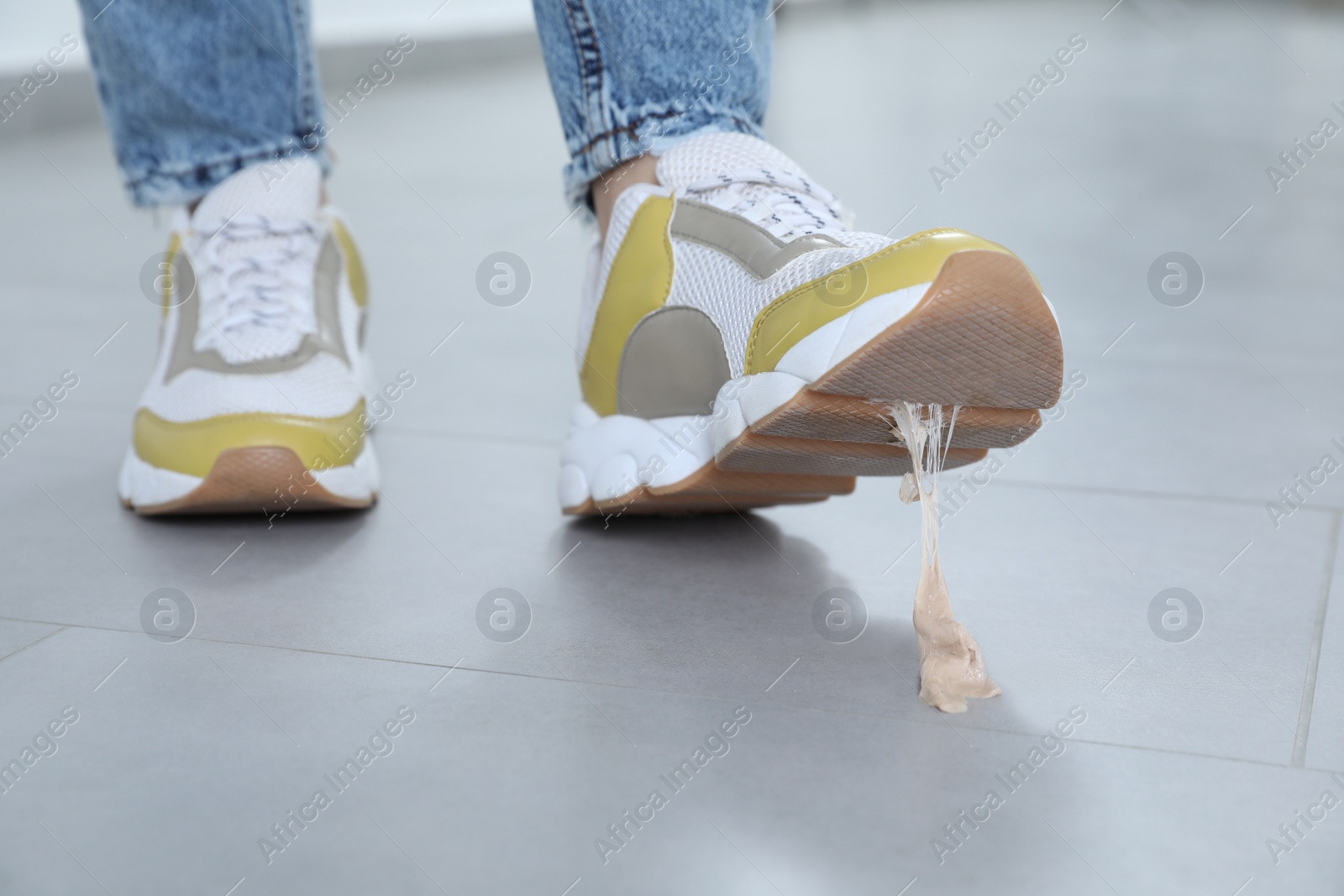 Photo of Person stepping into chewing gum on floor, closeup