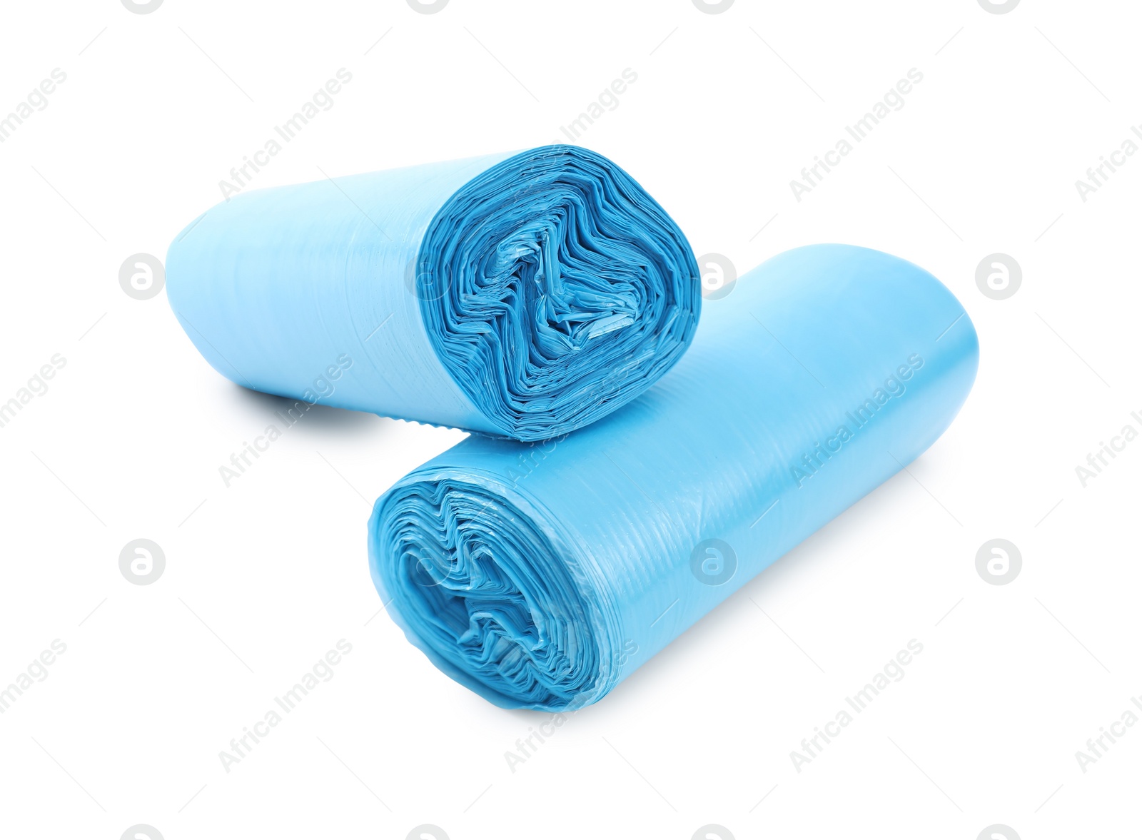 Photo of Two rolls of light blue garbage bags isolated on white