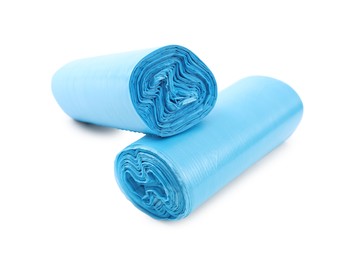 Photo of Two rolls of light blue garbage bags isolated on white