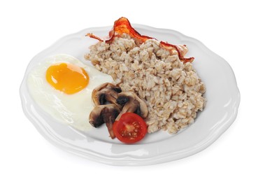 Photo of Tasty boiled oatmeal with fried egg, mushrooms, bacon and tomato isolated on white