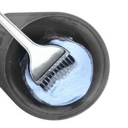 Photo of Bowl with hair dye and brush isolated on white, top view