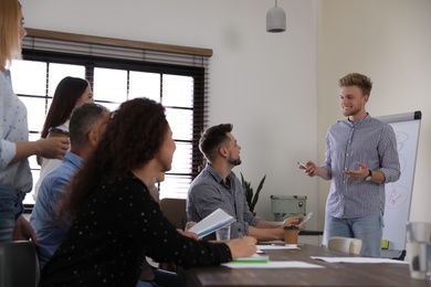 Portrait of volunteers having meeting in office