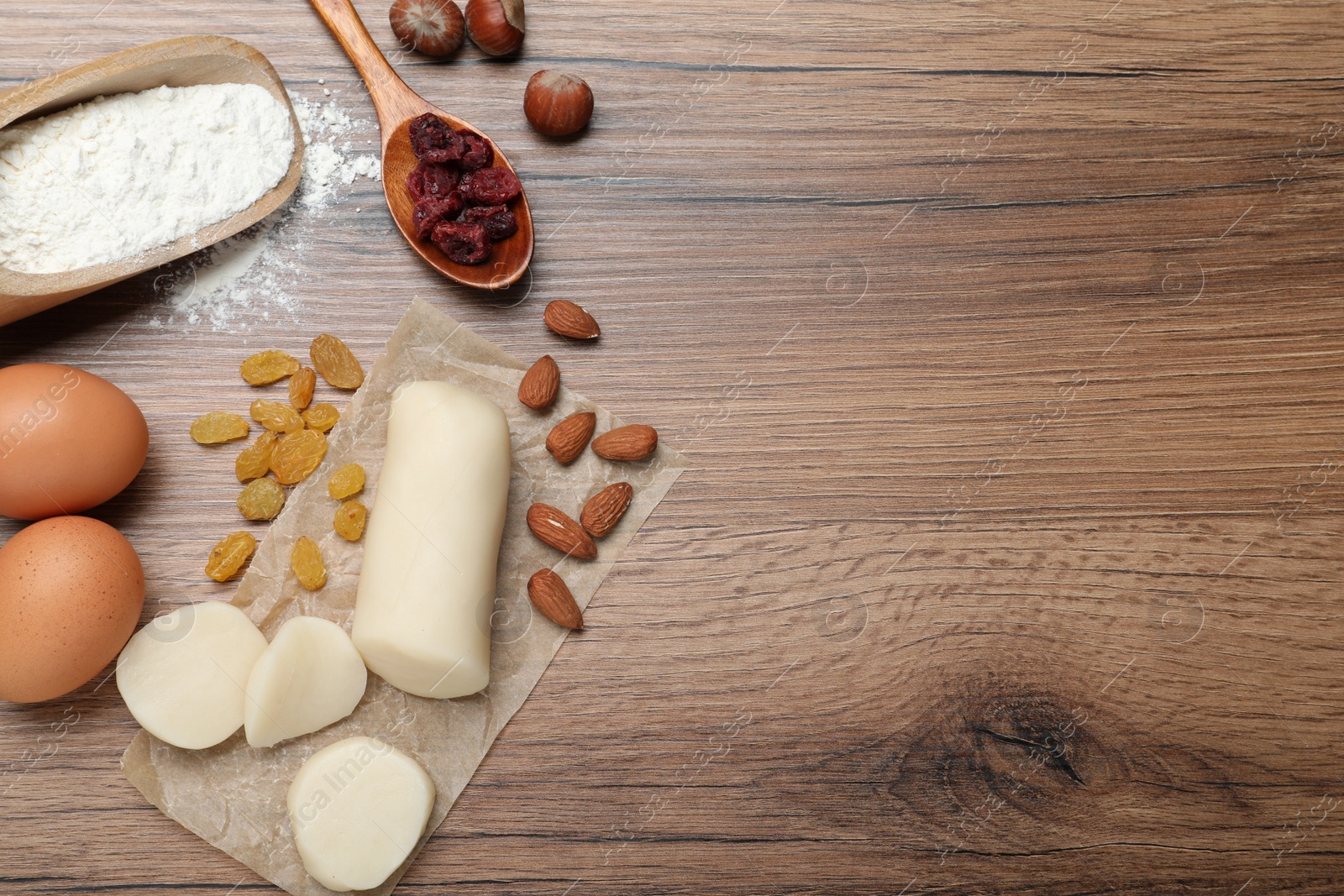 Photo of Ingredients for homemade Stollen on wooden table, flat lay. Baking traditional German Christmas bread