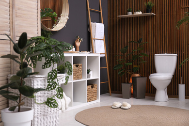 Photo of Elegant interior of modern bathroom with green plants