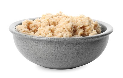 Photo of Bowl of tasty prepared horseradish isolated on white