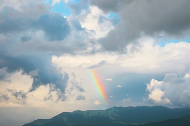 Photo of Picturesque view of sky with clouds and rainbow