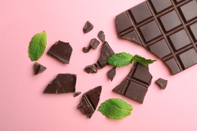 Photo of Flat lay composition with chocolate and mint on color background