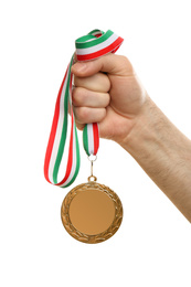 Man holding golden medal on white background, closeup. Space for design