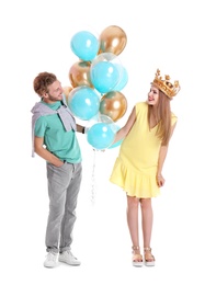 Photo of Young couple with air balloons on white background