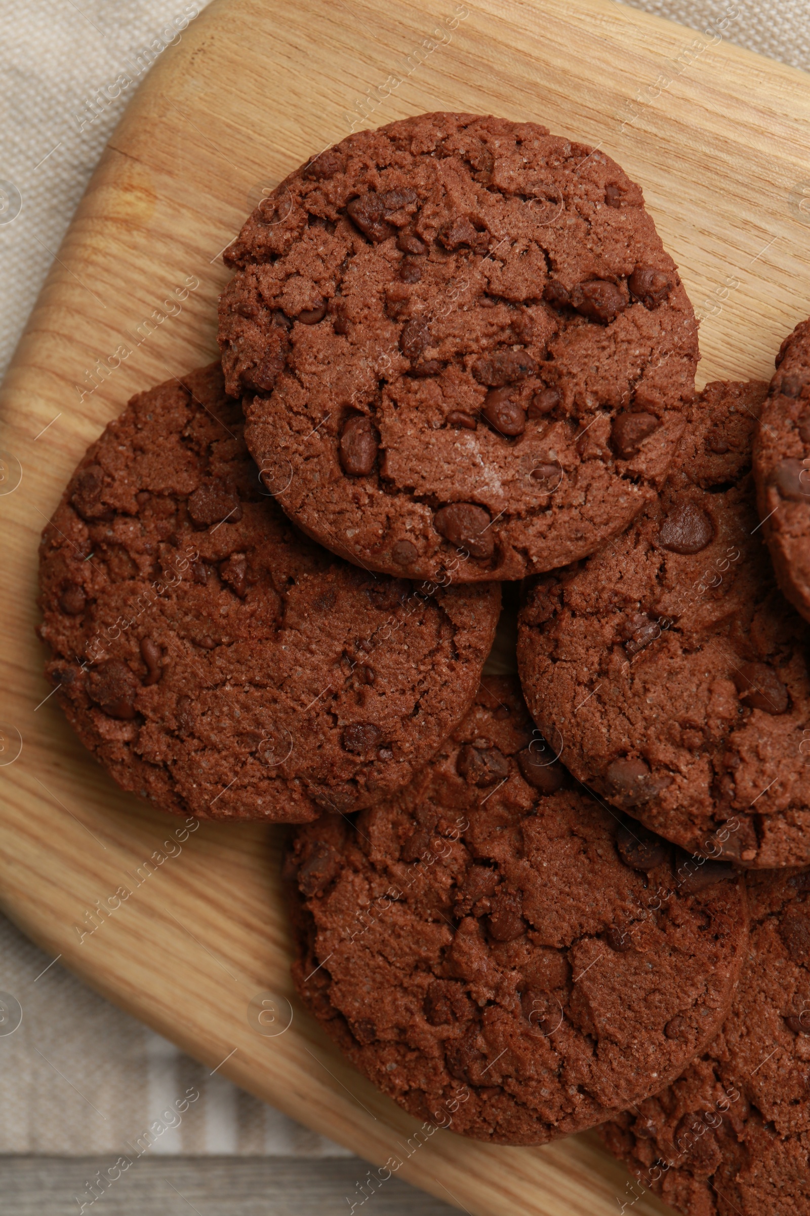 Photo of Delicious chocolate chip cookies on table, top view