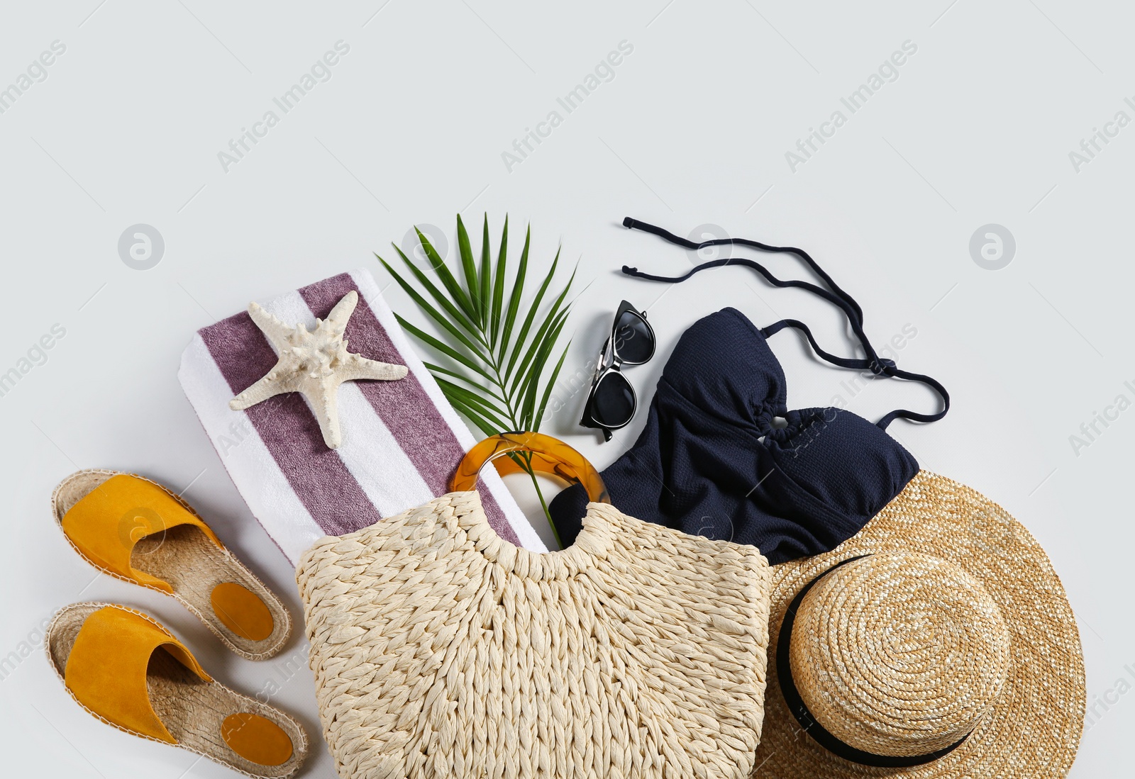 Photo of Composition with stylish beach accessories on white background, top view