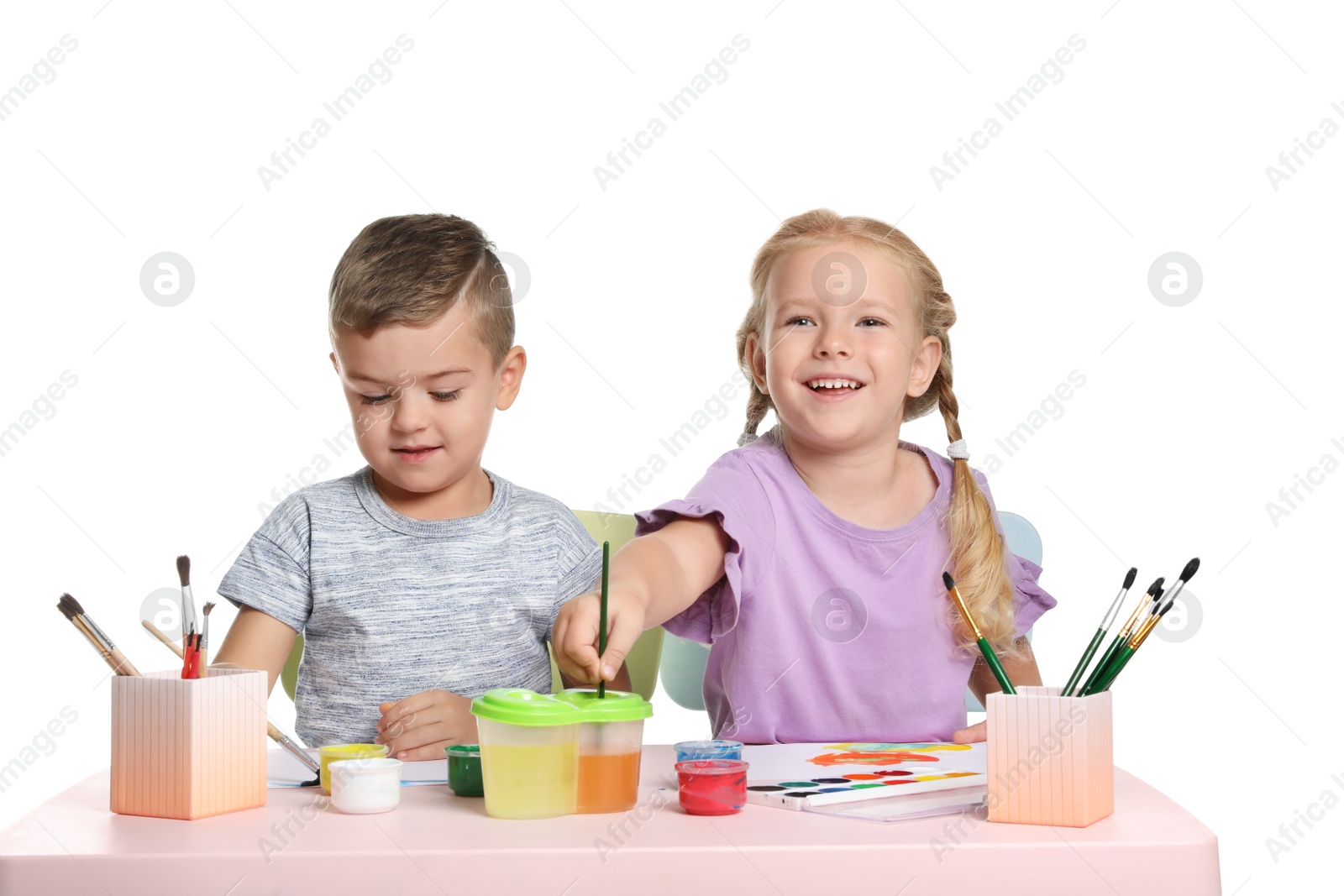 Photo of Cute children painting picture at table on white background