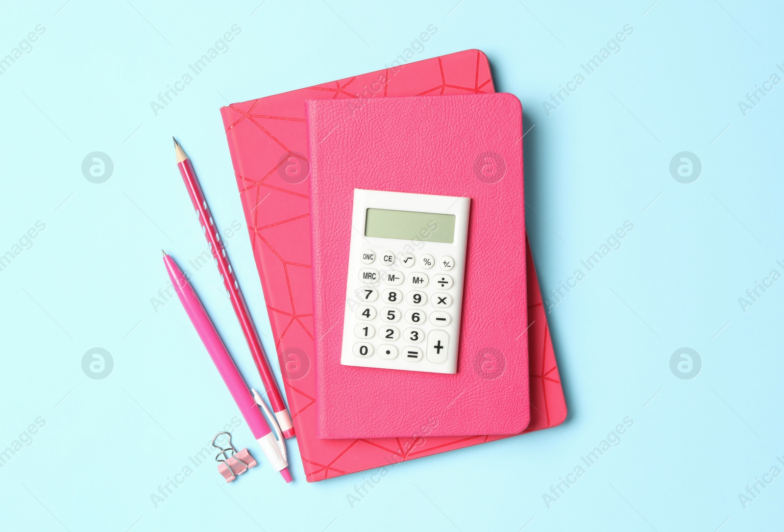 Photo of Flat lay composition with different school stationery on light blue background. Back to school