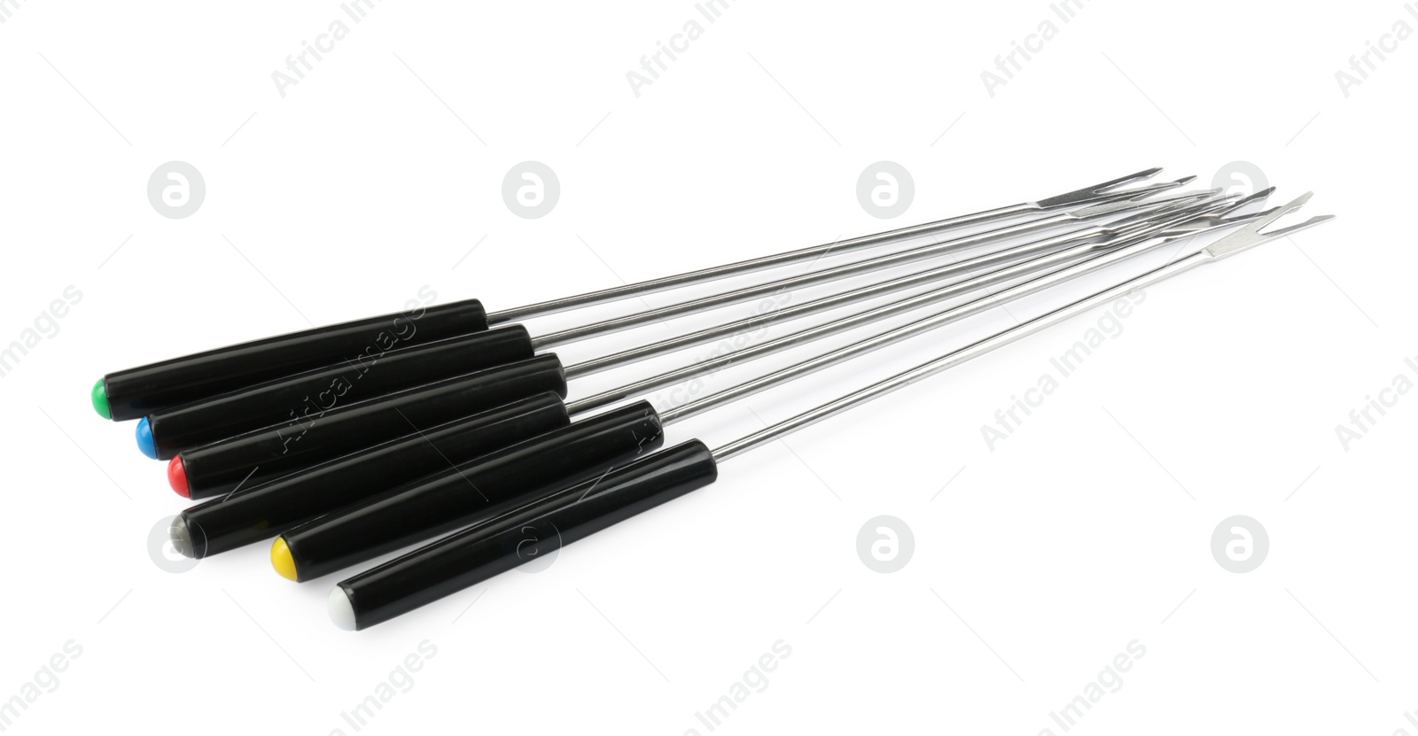 Photo of Set of fondue forks isolated on white. Kitchen equipment