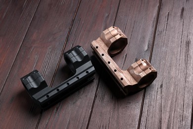 Photo of Quick disconnect sniper cantilever scope mounts on wooden table