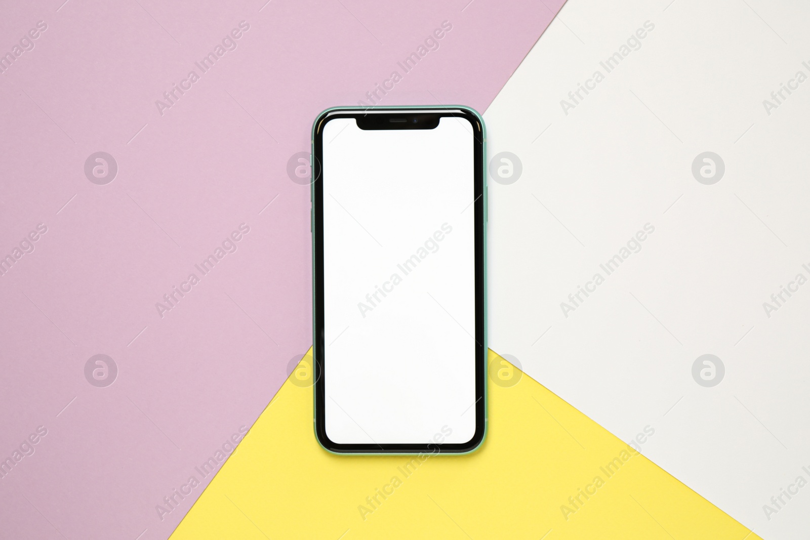 Photo of MYKOLAIV, UKRAINE - JULY 07, 2020: iPhone 11 on color background, top view. Mockup for design