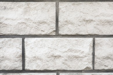 Texture of white brick wall as background, closeup