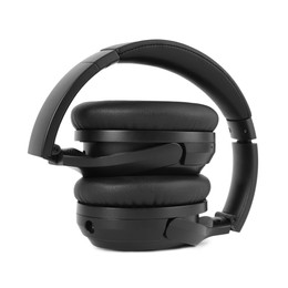 Photo of Modern black wireless headphones isolated on white