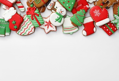 Photo of Different Christmas gingerbread cookies on white background, top view
