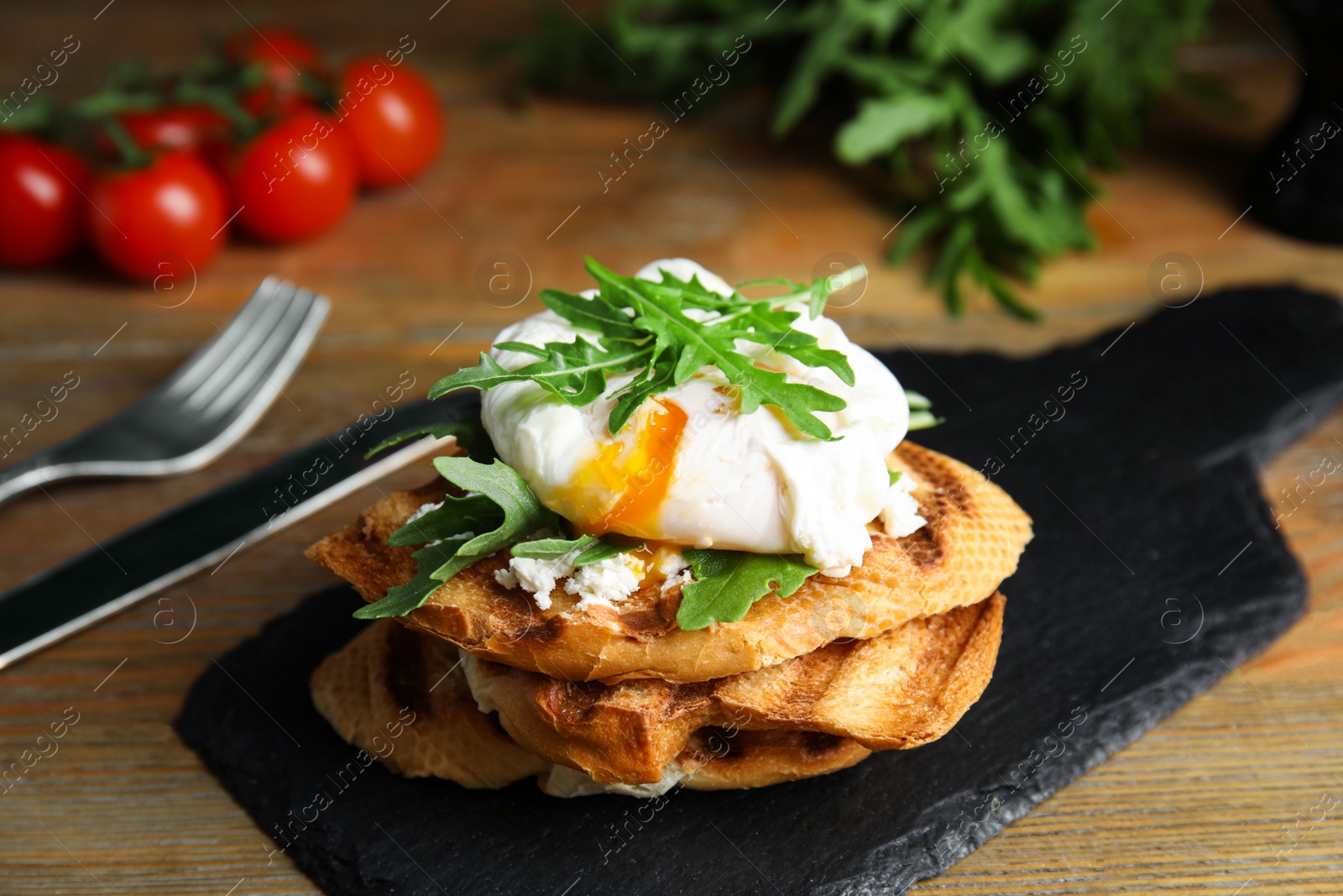 Photo of Delicious sandwich with arugula and egg on wooden table, closeup